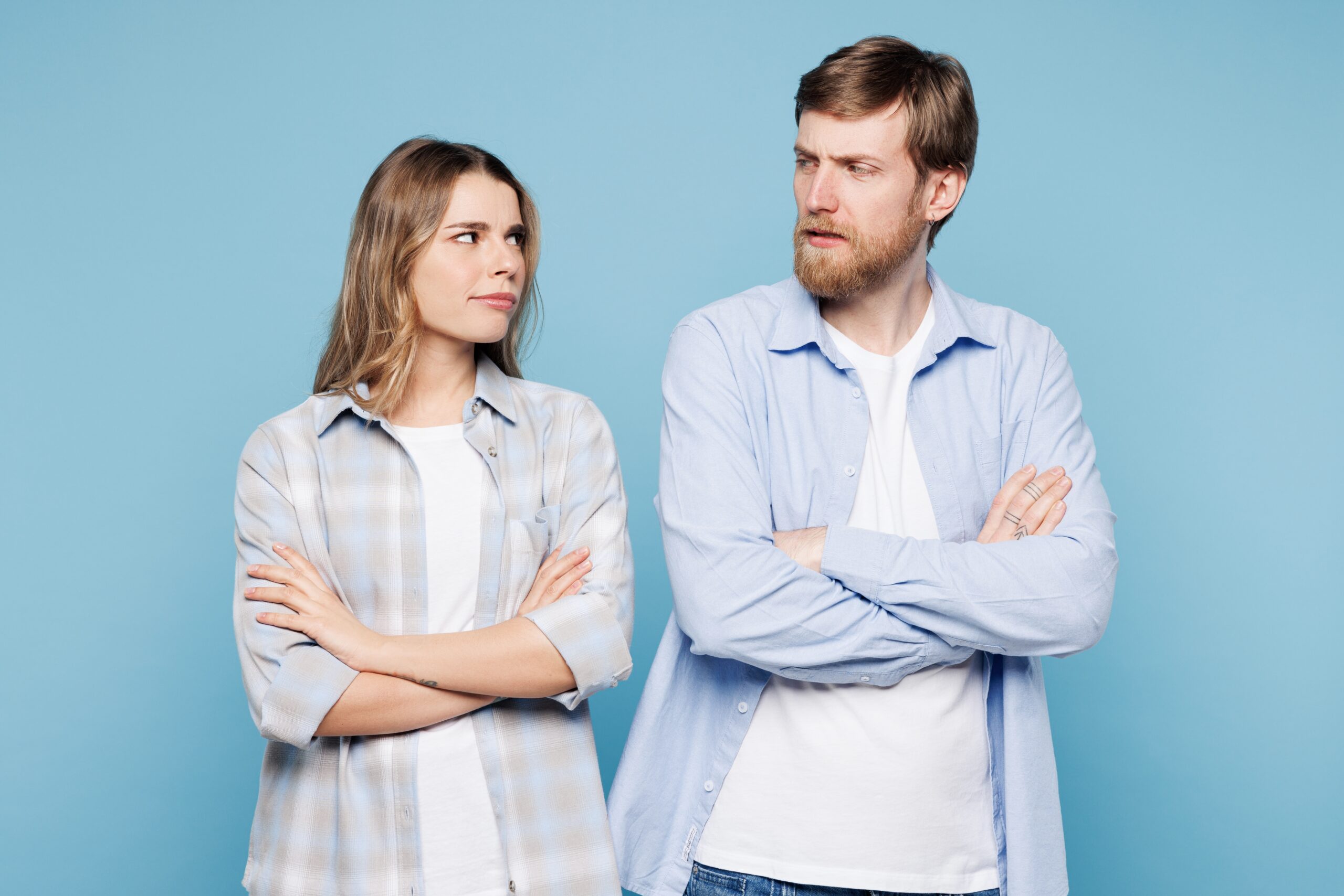 Couple in blue shirts dealing with anxiety issues affecting their relationship