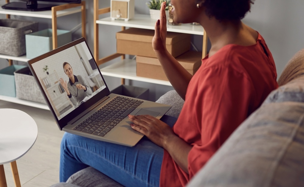 Woman in red shirt undergoing depression having online depression treatment