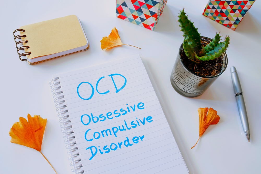 Notepad with Obsessive Compulsive Disorder written on it at a mental health treatment clinic
